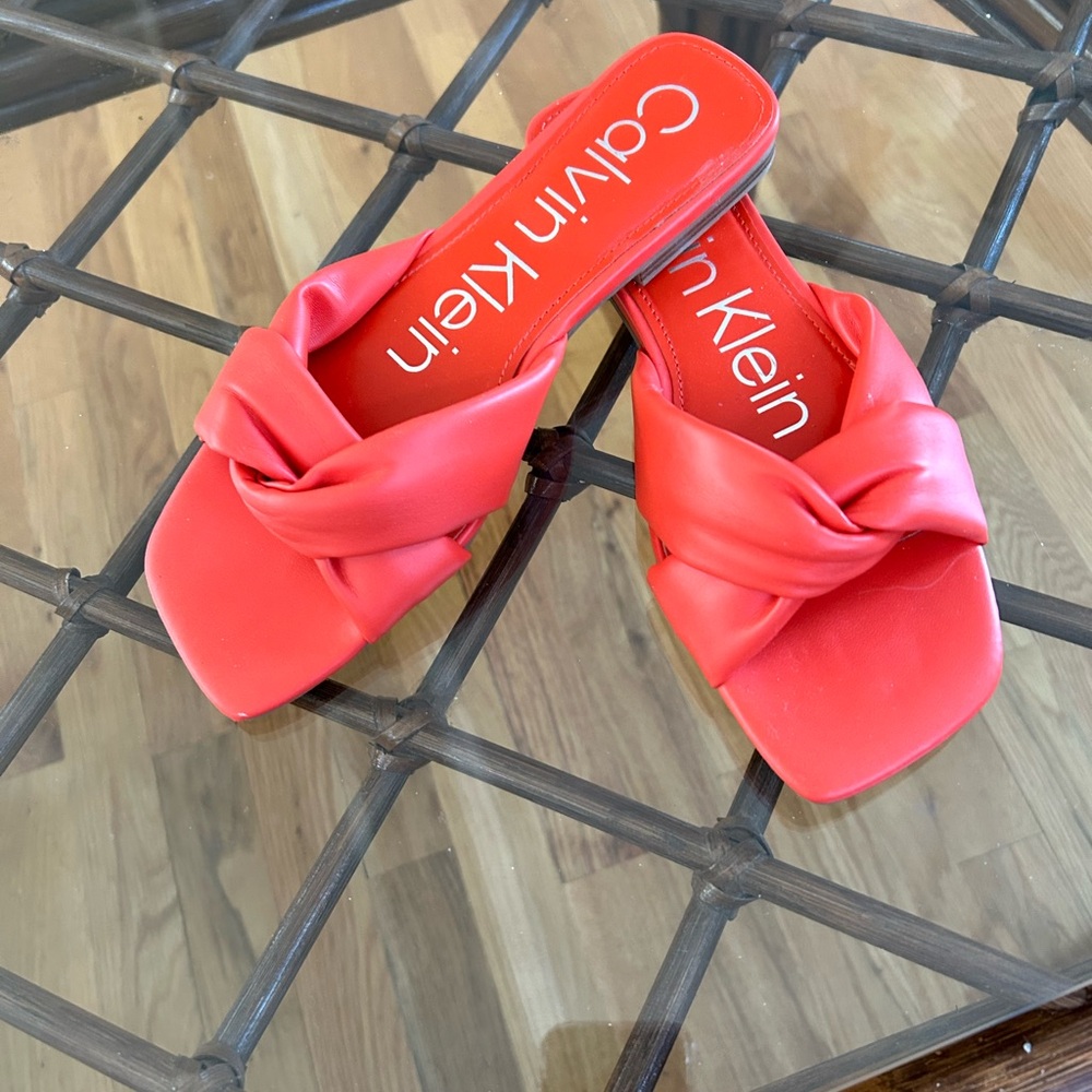 Calvin Klein flat sandals 1/4” heel. Size 6.5.  Faux leather with crossover band